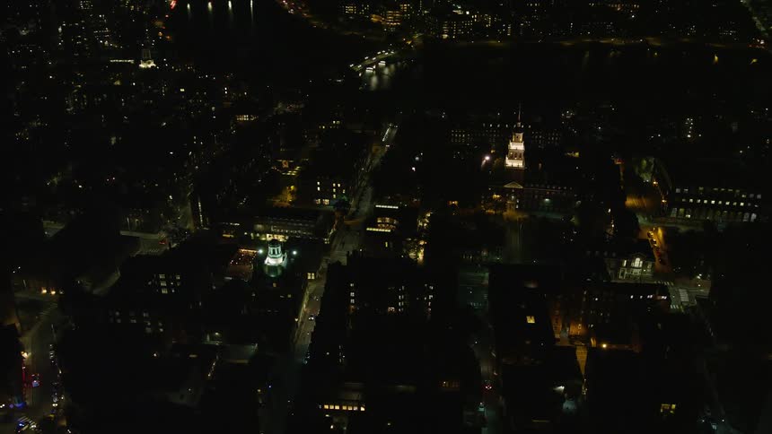 Aerial view of city scape and clock tower at night