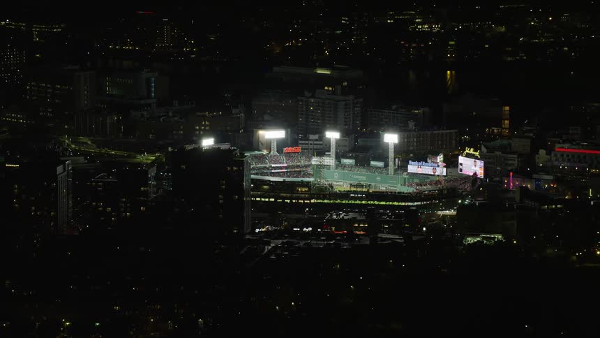 The baseball stadium is in the middle of the city