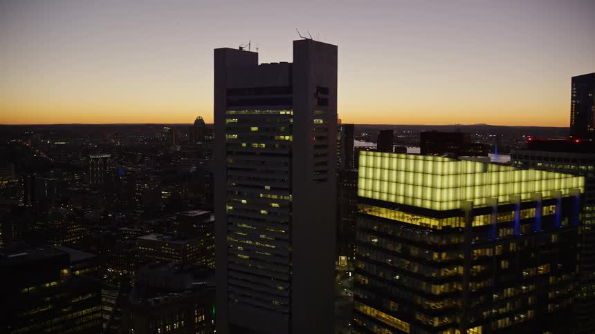 Skyscrapers and buildings in a city at sunset