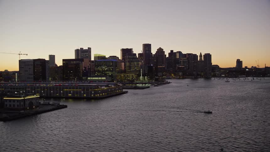 A metropolitan city with huge buildings facing the sea