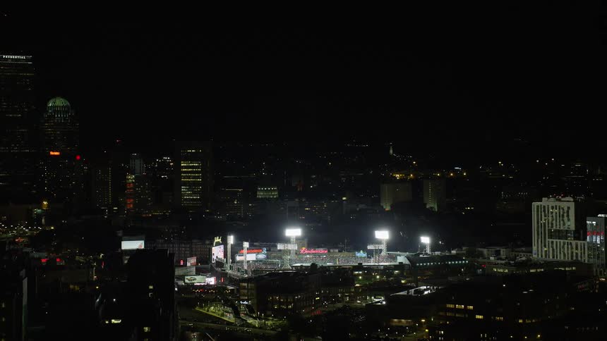 A very bright stadium in a night city