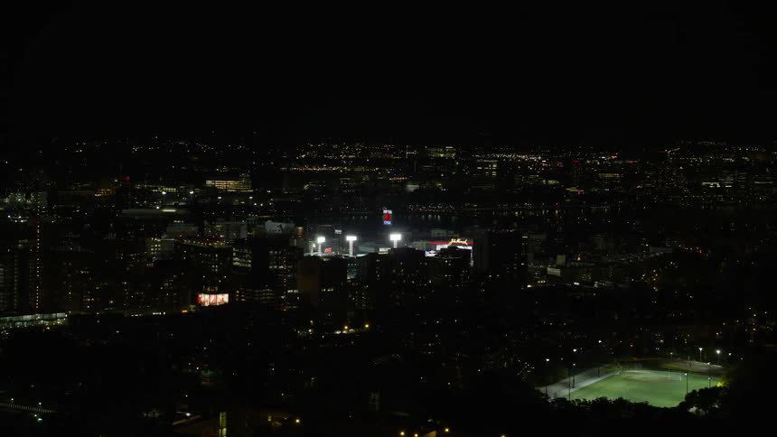 Stadium lights in a city at night