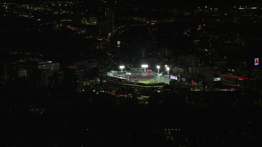 A very bright stadium in a night city
