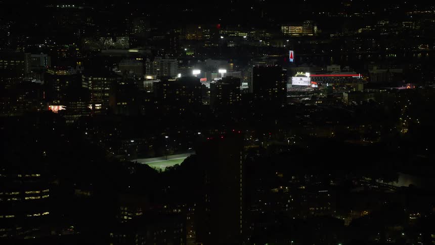 A stadium in a city at night