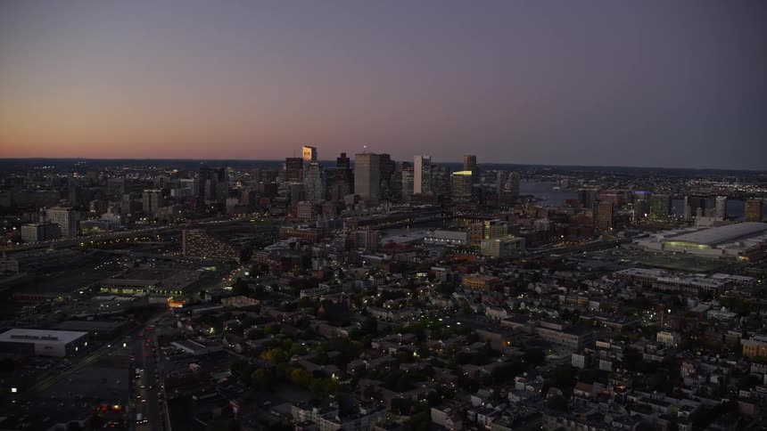Aerial view of a metropolis with a purple evening sky