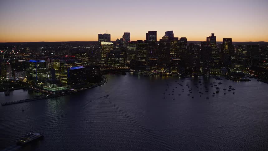 Waterways and skyscrapers in a metropolitan area at sunset