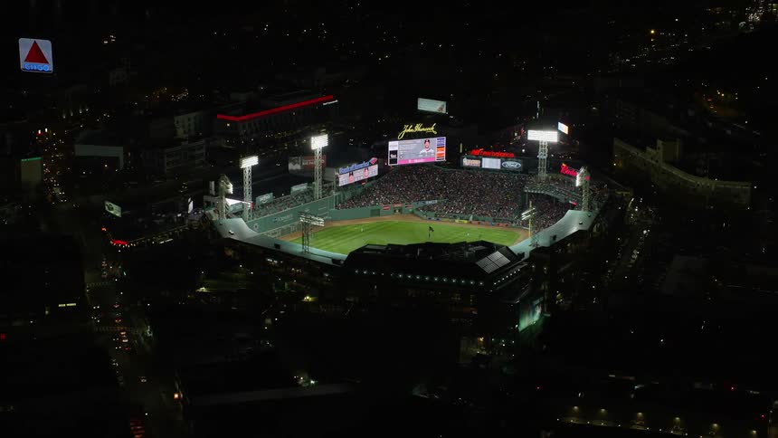 Aerial view of a baseball stadium in the city at night