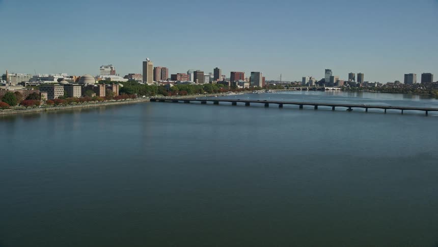 Aerial view of a metropolis by the sea with a massive bridge connecting the cities