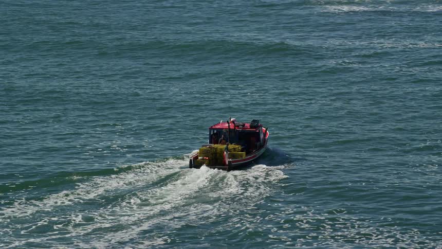Small cargo boat in the open sea
