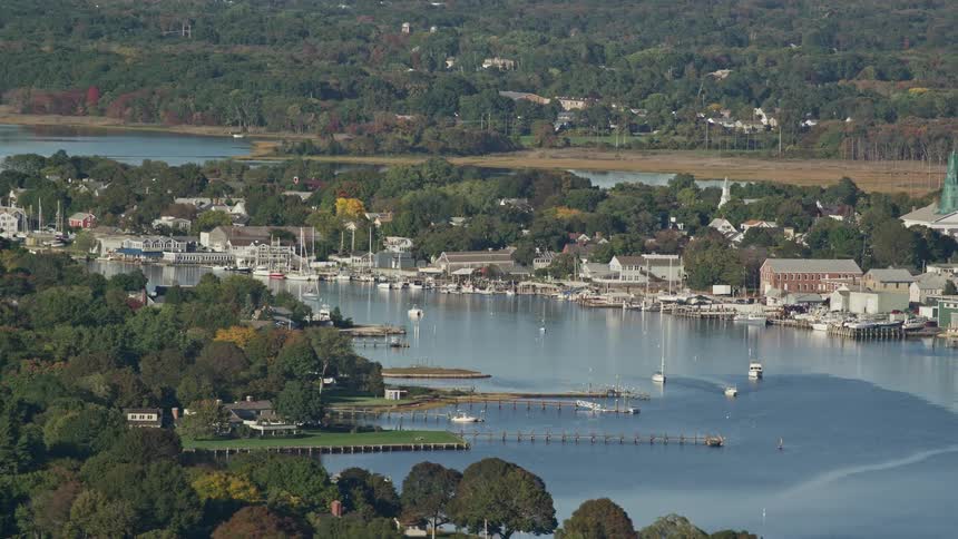 A large lake with several boats and marinas on the coast