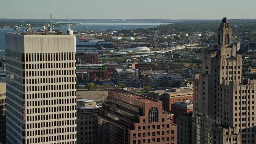 A city with tall buildings close to the ocean