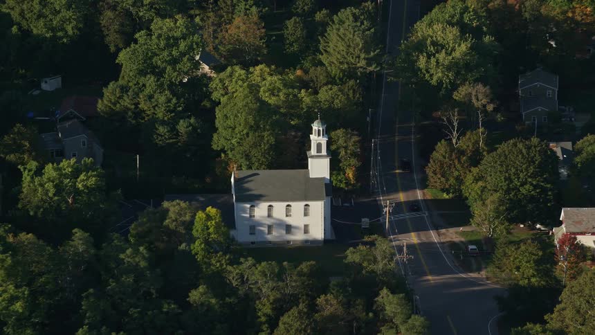 Aerial panorama of a church facing the highway