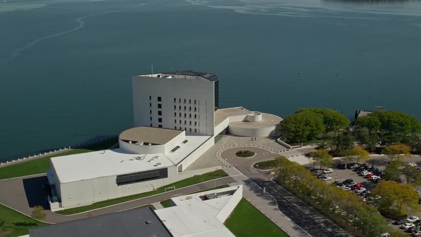 Aerial panorama of a white building by the sea