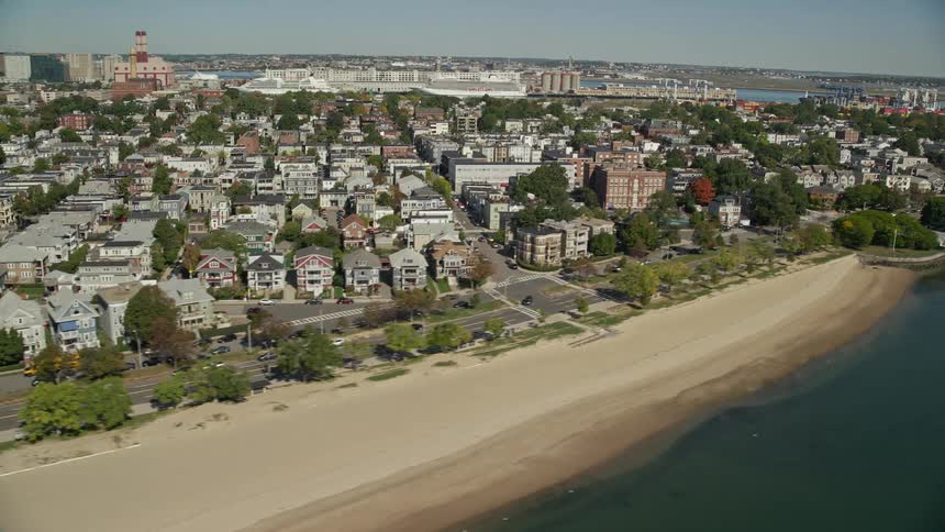 Aerial panorama of an urban city by the sea