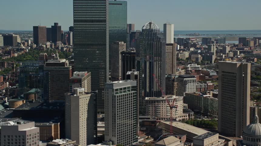 An aerial view of a tower block towntown in a city on the waterfront