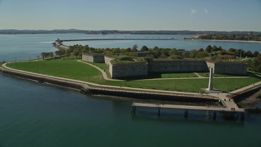 Aerial view of buildings on a waterfront city next to a lake
