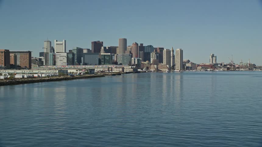 Aerial view of a waterfront city next to a river