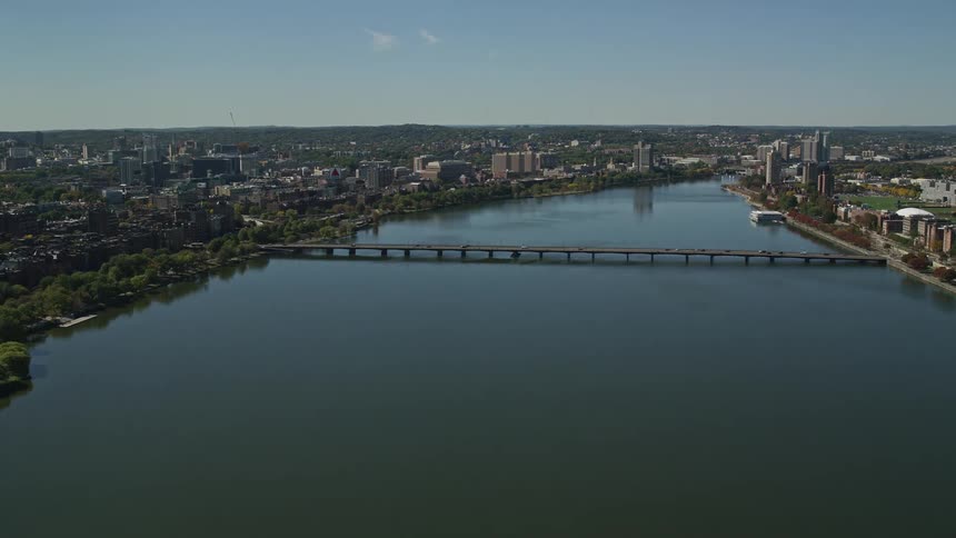 Aerial panorama of a bridge crossing the sea and connecting a metropolitan city