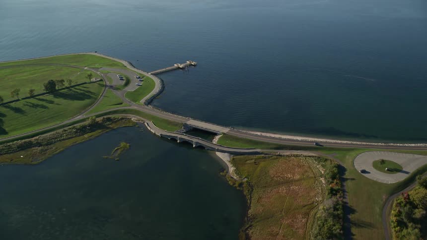 Aerial of a bridge over a river at midday