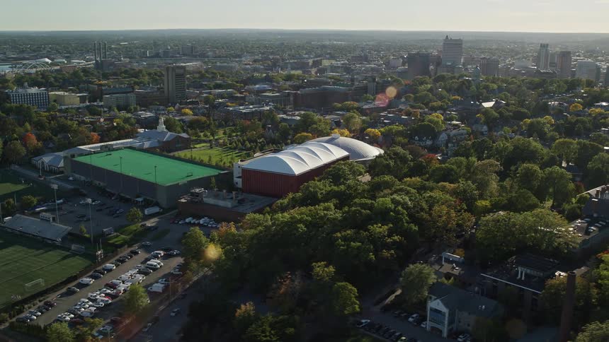 Aerial view of an arena in the city at sunset