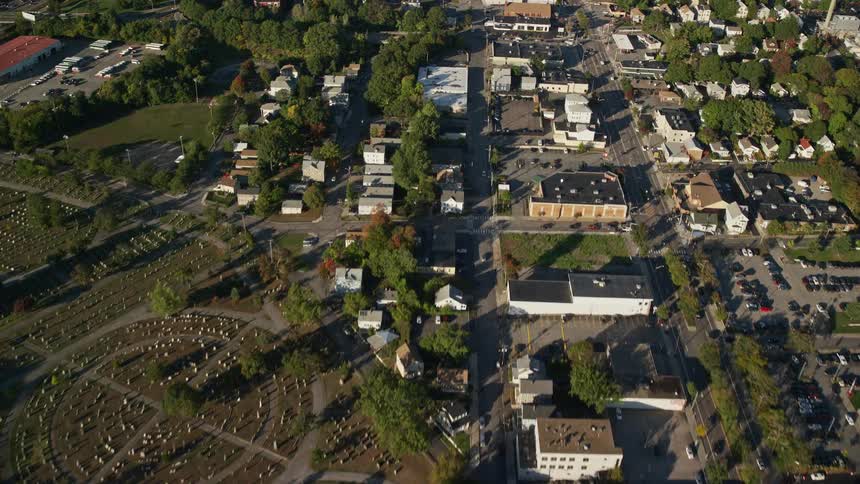 A city with rural parts with several trees and suburbs