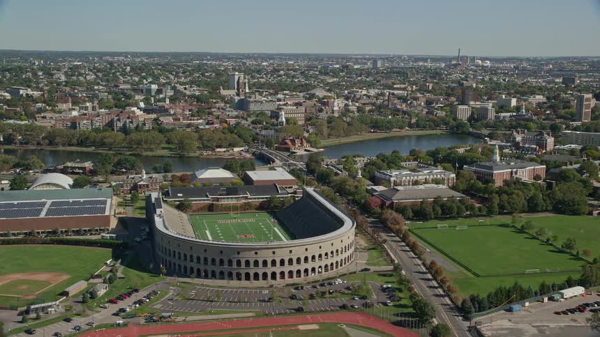 Panorama of a stadium by a lake in a city