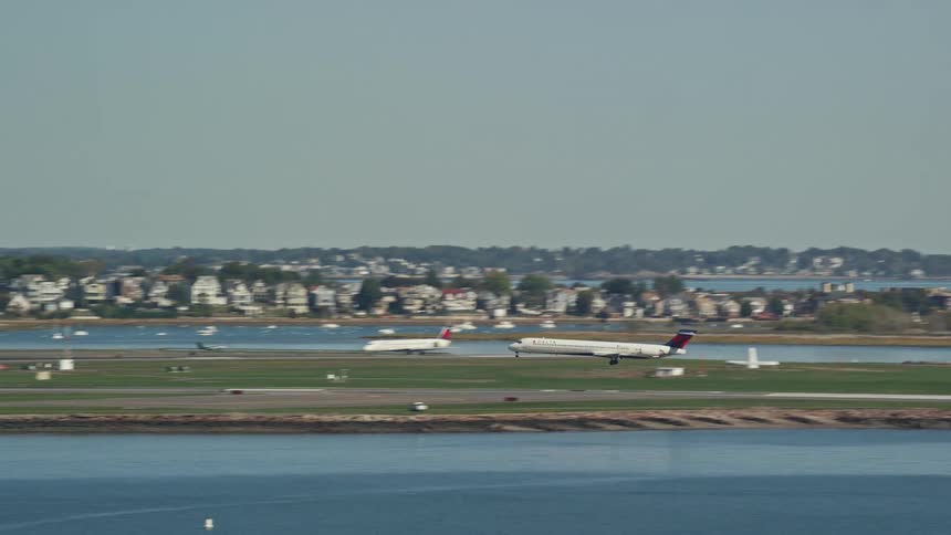 An airplane landing on the runway at midday