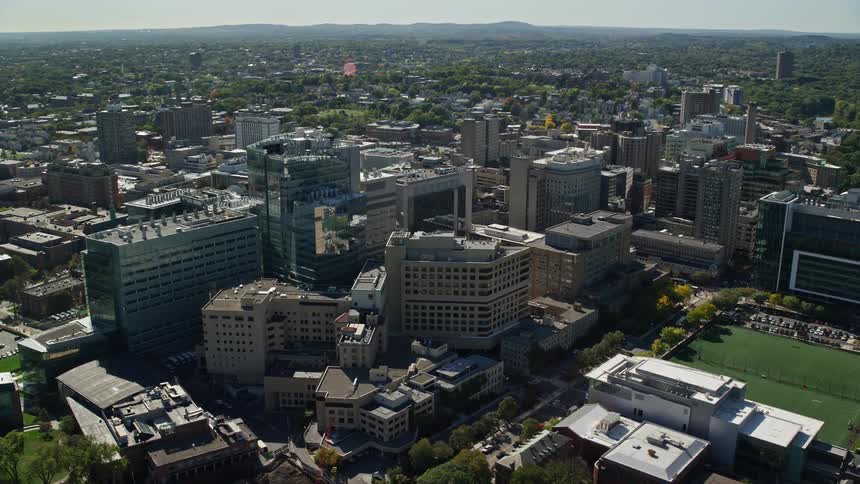 An aerial shot of a large building in the middle of the city