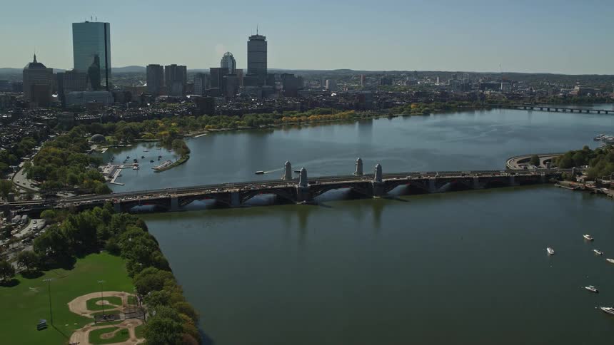 Aerial view of a bridge over a river next to the city