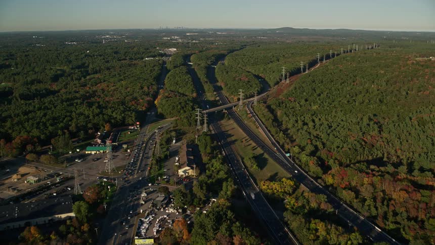 Aerial panorama of roads and highways amidst forested areas