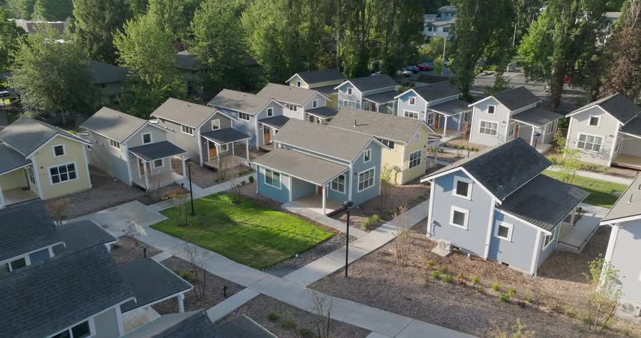 Pullback reveal over a cluster of tiny homes in a new community development