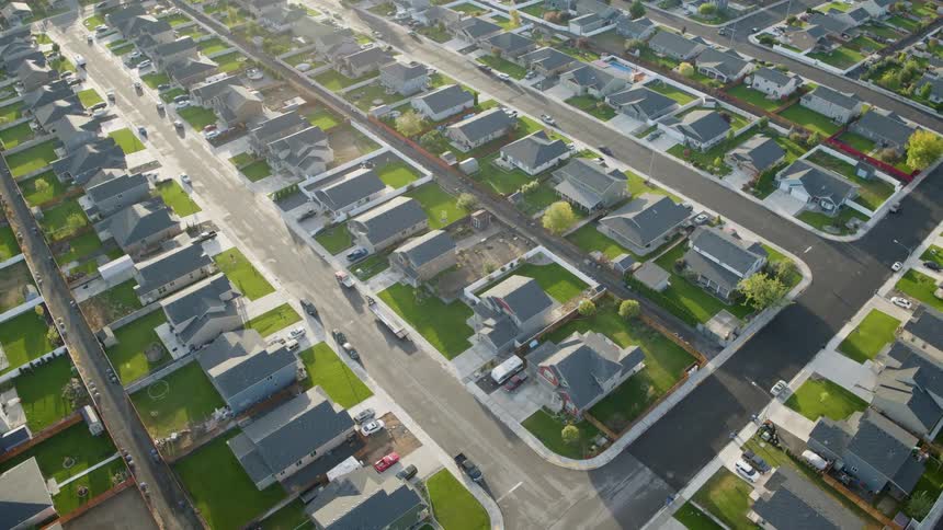Tilt up reveal of picturesque homes in a new suburban development
