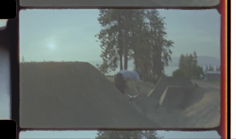 Person riding a bicycle doing stunts on a ramp at morning