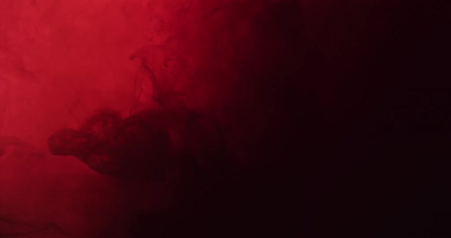 The red ink floats in the murky water