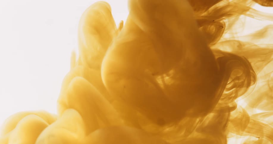 Abstract yellow smoke being released on a white background