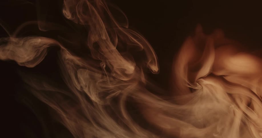 Cloud of cream and brown ink floating and mixing
