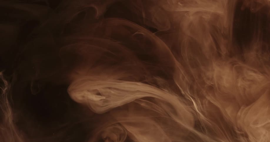 Pale gas flows through air against a dark background
