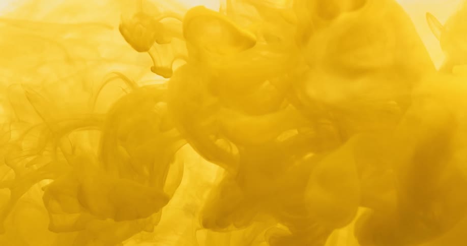 Yellow smoke being dispelled in abstract movements