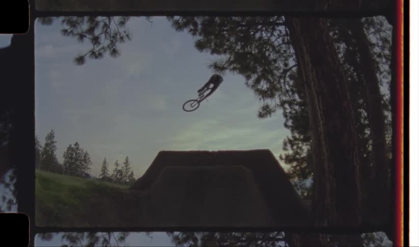Person riding a bicycle doing stunts on a ramp at morning