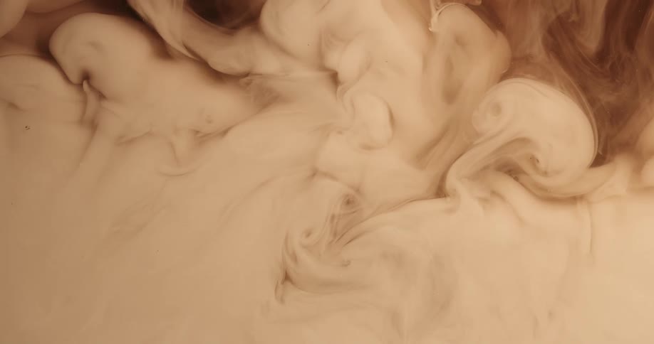 Cloud of cream floating and mixing