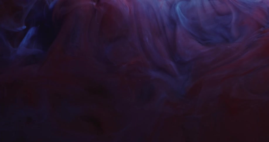 Cloud of dark blue and purple ink mixing