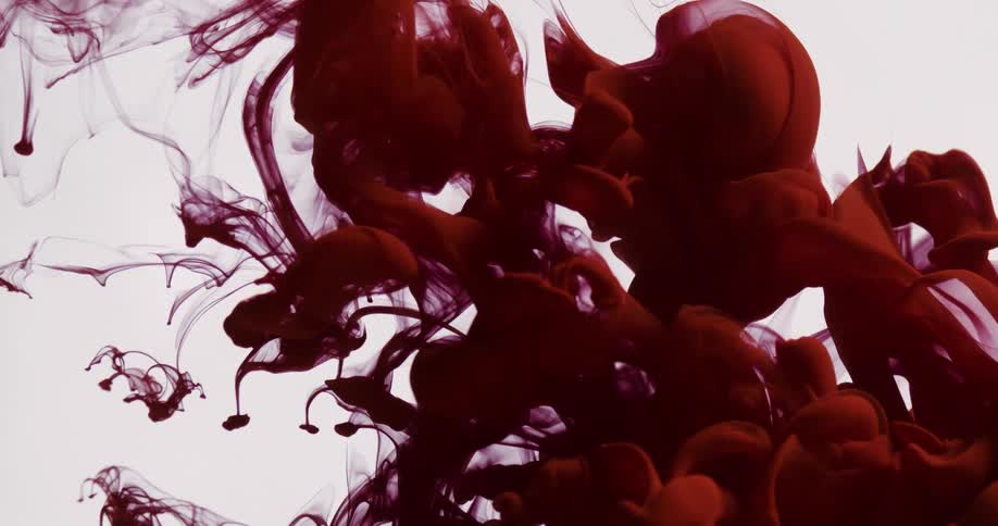 Abstract red smoke being released on a white background