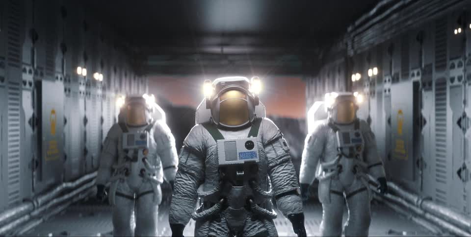 Three astronauts wearing spacesuits stand in corridor with view of alien planet