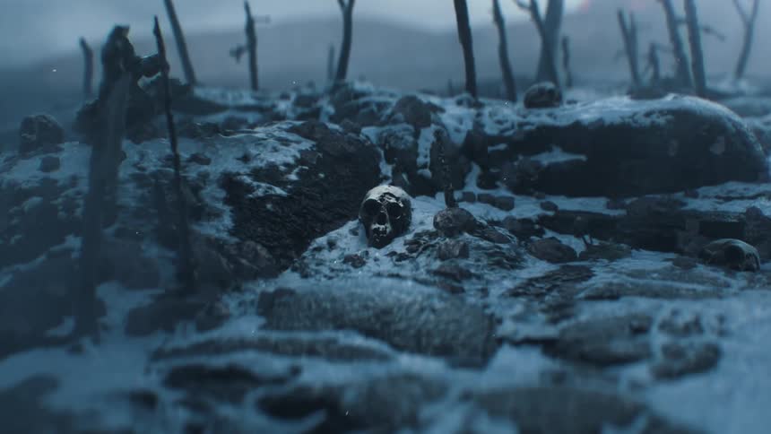 A scull resting on a barren landscape covered in ashes