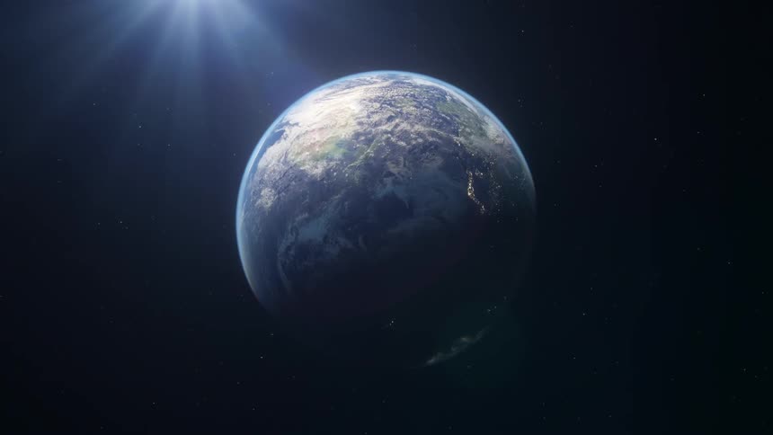 The earth as seen from outer space with rays of sunshine in the background