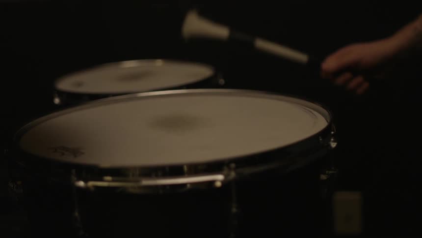 A person is playing the drums