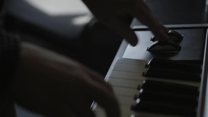A person is playing a keyboard