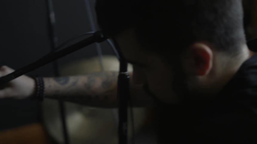 A man plugs in a microphone