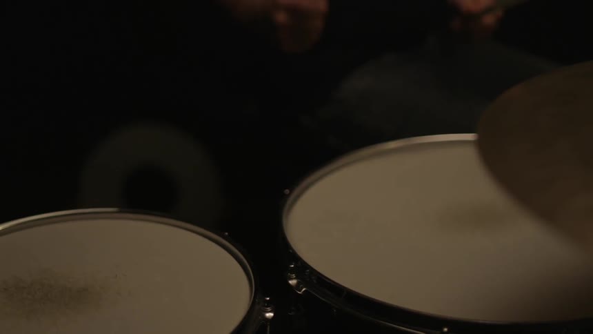 A person is playing drums