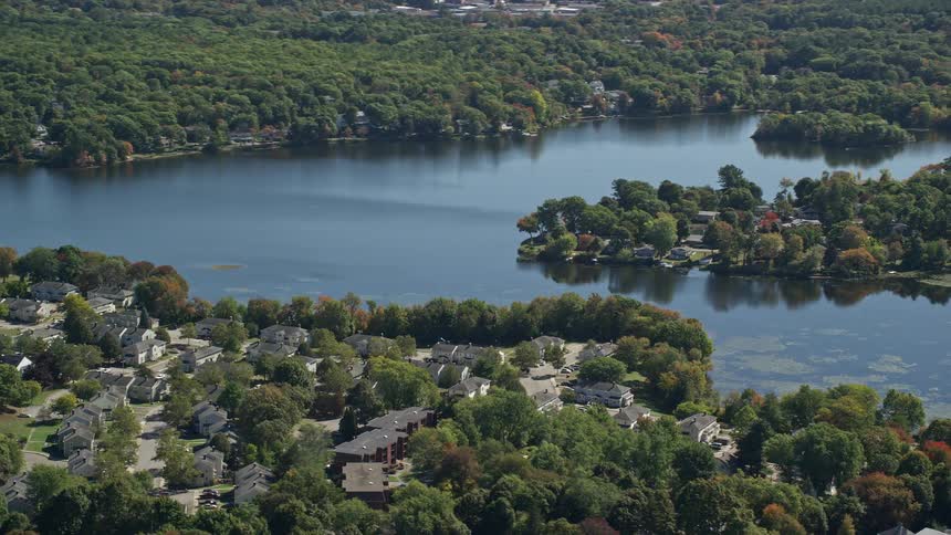 An aerial of a residential neighborhood built around a lake
